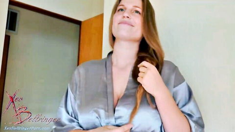 Blonde MILF teases deep cleavage in open silk robe while brushing long hair POV