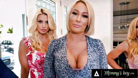 Busty blonde MILF and two young blondes flaunt massive cleavage in low-cut dresses for Mommy's Boy