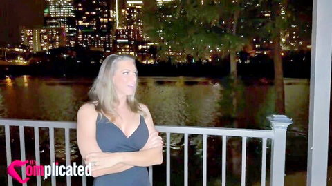 LorReign angry in low-cut black dress on night balcony overlooking city
