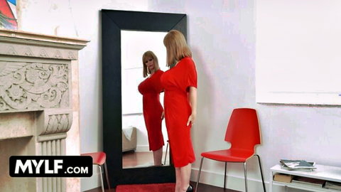 Blonde MILF in tight red dress teases in mirror flaunting huge tits and curvy ass
