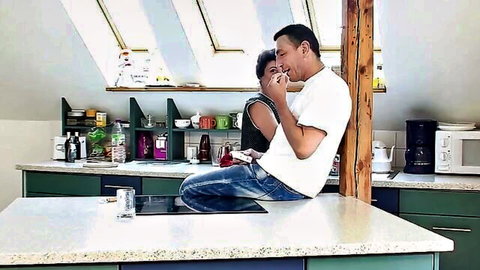 Helga 57 embraces man in intimate kitchen moment, mature couple passion