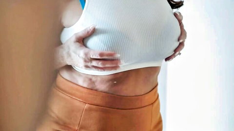 Blonde MILF Maddie Cross squeezing her big tits in tight white tank top