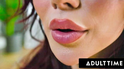 Close-up of sexy brunette trans babe's plump glossy pink lips parted wide for cock sucking
