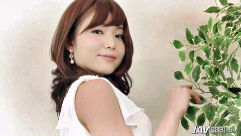 Shino Midori in white frilly top, smiling playfully