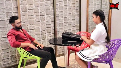 Desi student Natasha Rajeshwari in school uniform chats with teacher