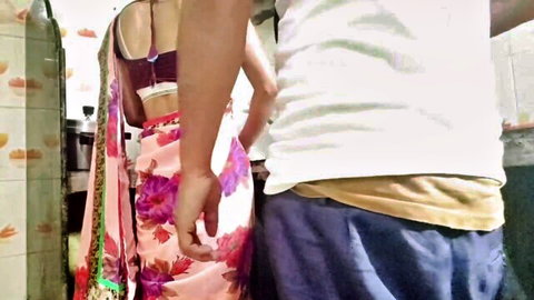 Pakistani maid Nebartan Dhone in pink saree with Malik from behind