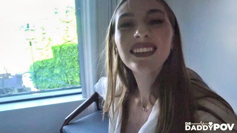 Angel Youngs smiling seductively in doctor's POV, long hair and white top