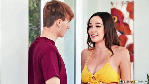 Redhead guy stares at busty Asian babe in skimpy yellow bikini top flaunting massive tits