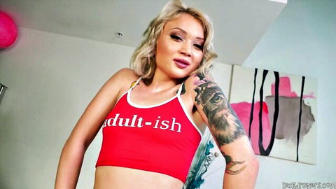 Dakota Skye in sexy red adult-ish tank top, blonde with arm tattoos