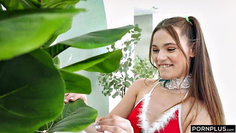 Juniper Ren in sexy red Santa bikini lingerie, smiling playfully