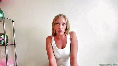 Katie Diamonds blonde in tight white tank top, wide-eyed surprise