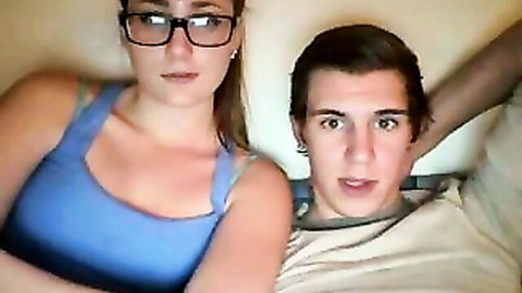 Amateur couple thumbnail: Woman in blue top with glasses strokes man's big dick
