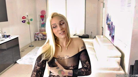 Alexis Andrews in sheer black lace lingerie, teasing with curves and tattoos
