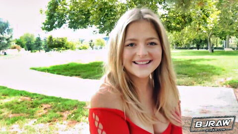 Kimora Quin smiles in red off-shoulder top flaunting natural cleavage outdoors