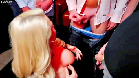 Blonde babe surrounded by men groping her as huge cock pokes from blue underwear for gangbang blowjob