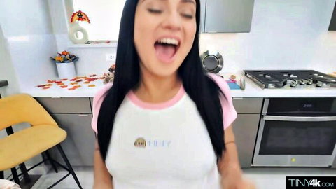 Young athletic brunette teen laughs mouth wide open in tight Tiny4K shirt kitchen tease
