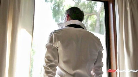 Carolina Sweets teen porn scene: suited man gazing out window, innocent youth vibe