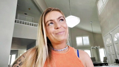 Krissy Knight blonde smiling in orange top, teasing before deep fuck frenzy