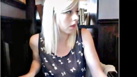 Blonde in sheer black tank top poses seductively in solo tease