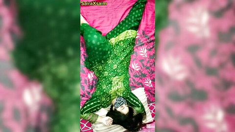 SaraSaim blindfolded in green salwar kameez, lying seductively on bed
