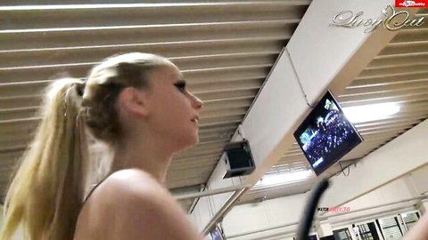 Topless blonde ponytail teen with small tits looks up in gym under slutout playboytv screens