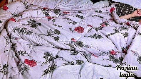 PersianLayla in floral bed sheets, hand on pillow, teasing stepmom vibe