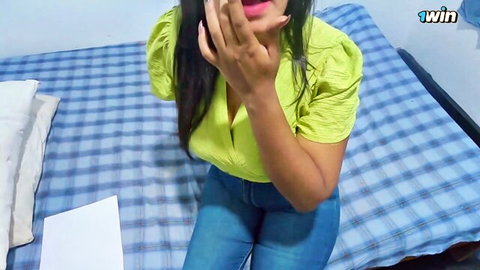 Naughty Indian babe in green blouse teasing with cleavage