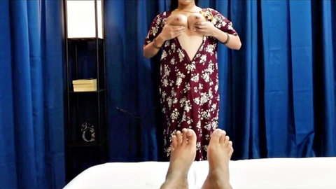 Desi Bhabhi in floral dress teasing cleavage for seductive handjob