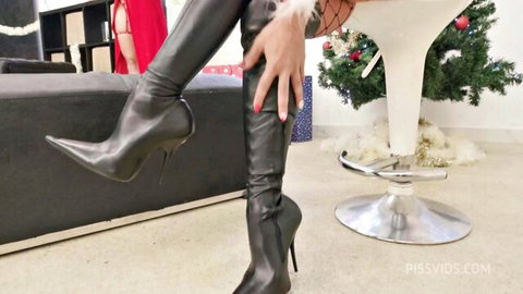 Vittoria Divine and Nuria Millan in leather thigh-high boots for naughty Xmas fisting