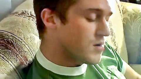London Lane in profile view, smoking seductively in green shirt