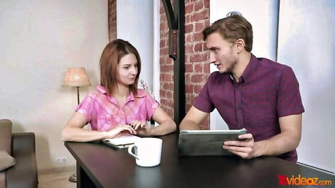 Brunette college girl in pink blouse chats with guy during casting interview