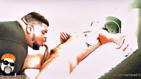 Bearded muscular guy sucking big erect cock of tattooed shirtless man in gay blowjob