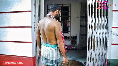 Sweaty shirtless muscular Indian man in striped dhoti standing at home doorway