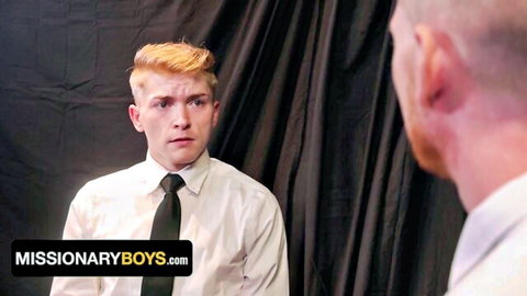 Freckled ginger twink missionary stares intently at redhead in suit in gay taboo scene