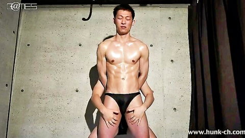 Muscular Asian hunks teasing in tight black briefs with ripped abs and huge cock bulges