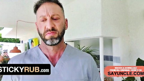 Mature bearded doctor in open scrubs ready for erotic massage session