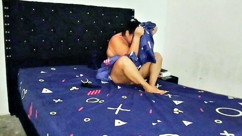 Indian amateur babe with big tits hides face with blue shirt spreading legs on bed