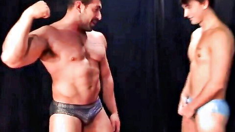 Muscular Masyn Thorne flexes with Damien Stone in tight speedos