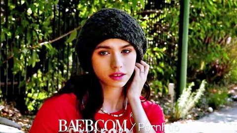 Lucy Cline, petite skater chick in red top and beanie, dark hair outdoors