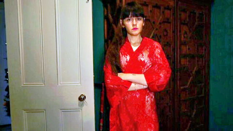 Curvy brunette MILF in sheer red lace lingerie robe arms crossed teasing big tits
