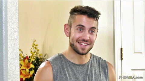 Micah Martinez smiling in gray tank top from Paisley Porter BBC threesome