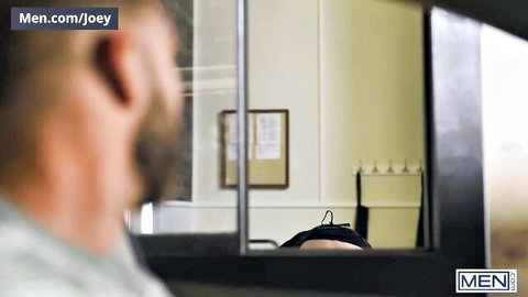 Gay store employee sucking cock in fitting room mirror reflection