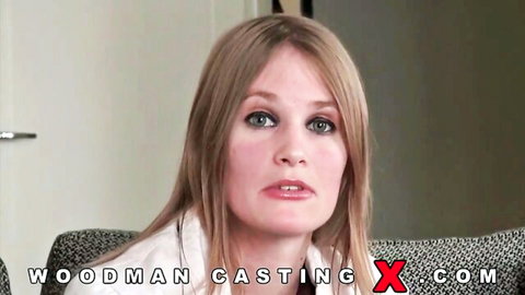 Blonde young woman in casting interview with seductive pout and medium natural tits
