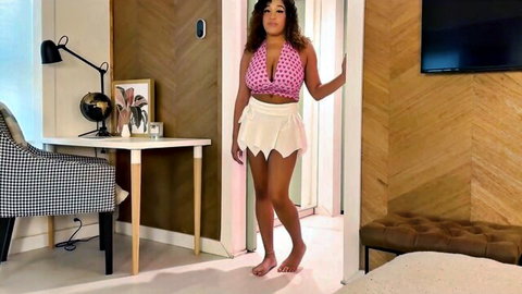 Curvy black babe in skimpy pink halter top and tiny white skirt teasing huge tits and thick thighs