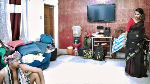 Two hot Indian women in saree and revealing top lounging in messy homemade bedroom