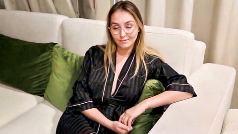 Alina Rai in open black silk robe, blonde with glasses, seductive lounge