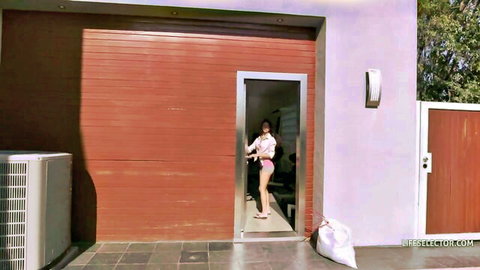 Petite tanned Latina babe with small tits in tight shorts teasing in garage doorway