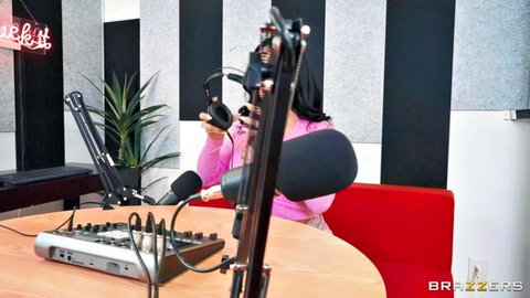 Brunette babe in pink sweater at mic, bubble butt set for hardcore ride