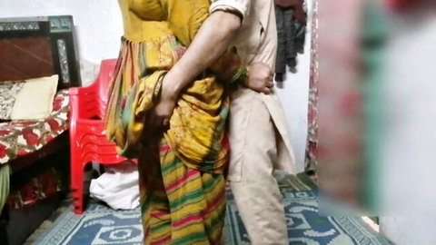 Pakistani teen in colorful saree embraced intimately from behind