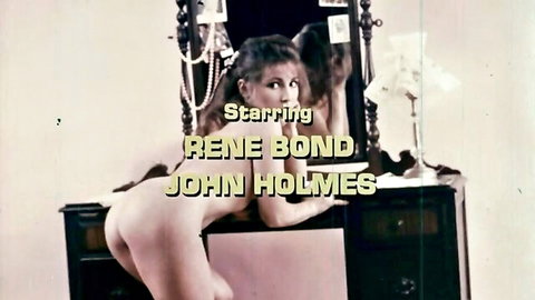 Vintage Renee Bond nude bent over vanity with John Holmes, 1970s POV porn